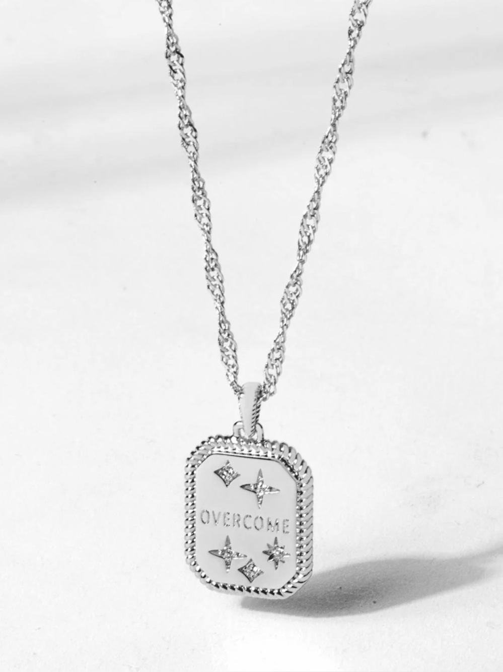 This is the origami owl OVERCOME necklace in Silver